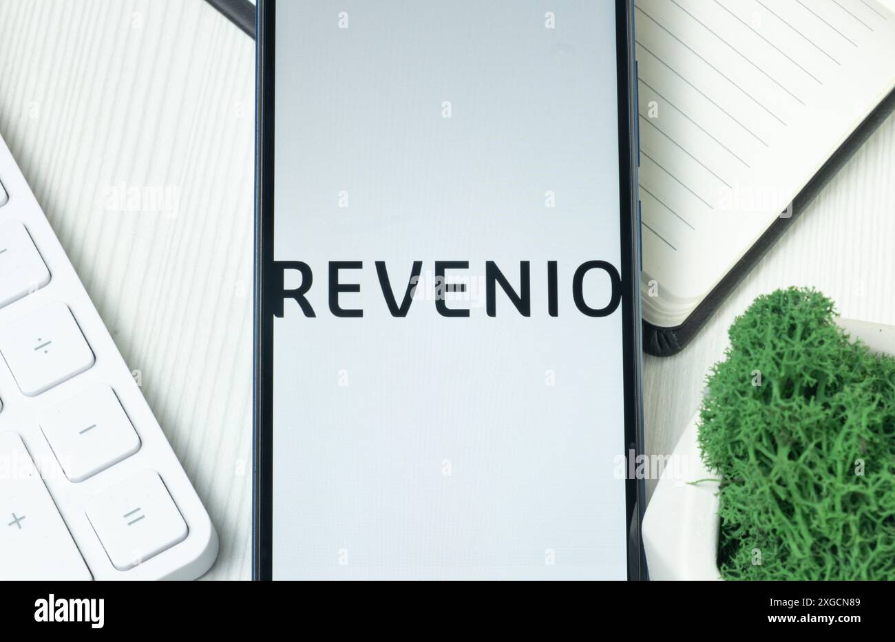 New York, USA - 21 June 2024: Revenio Logo on Phone Screen, Company Icon. Stock Photo
