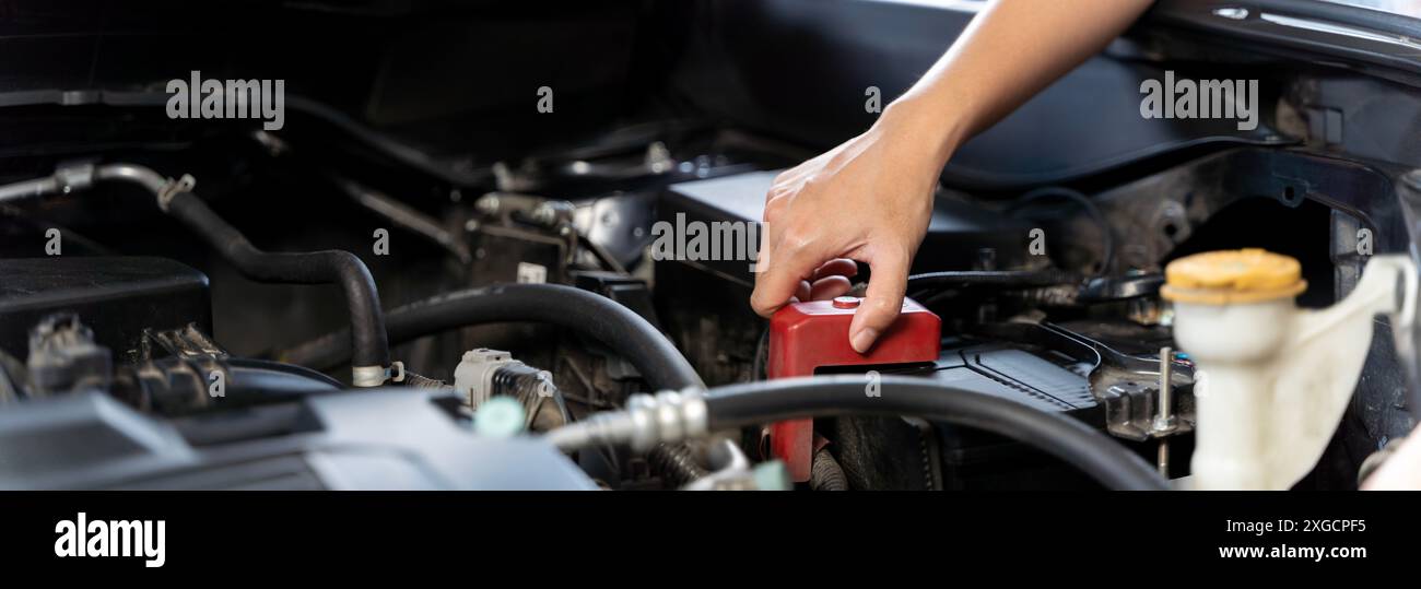 Asian driver woman checking car radiator problems on the road, office female checks break down vehicle engine. Travel problems waste time, pickup truc Stock Photo