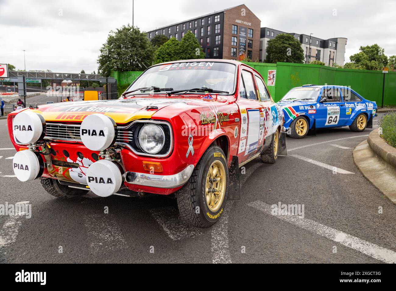A Ford Escort rally car with full decal parked on the road in an urban environment. Stock Photo