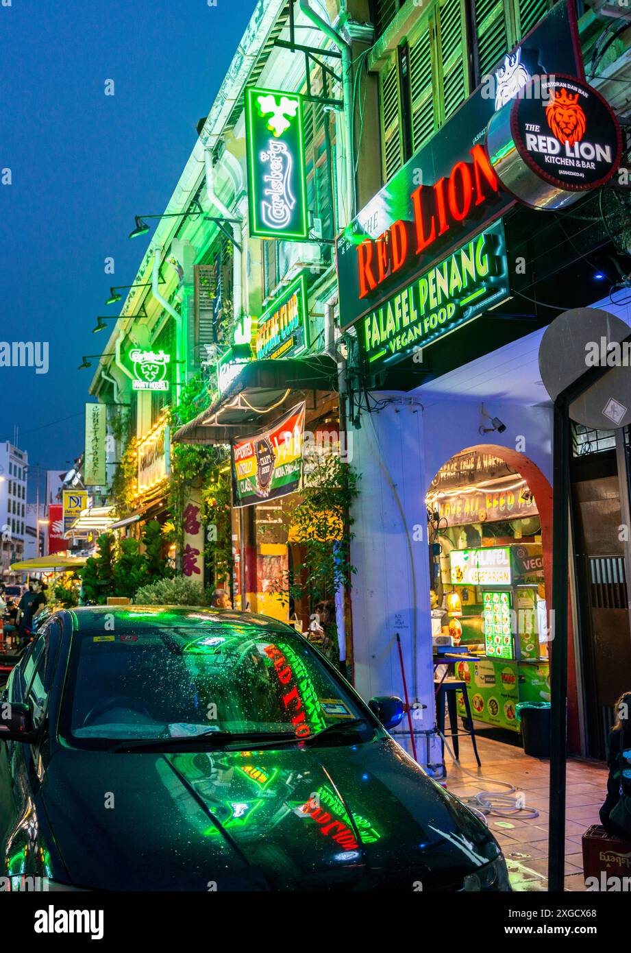 Penang,Malaysia-April 27 2023:The beautiful and colorful architecture of Chinese and British colonial era buildings,in the evening,the bars and restau Stock Photo