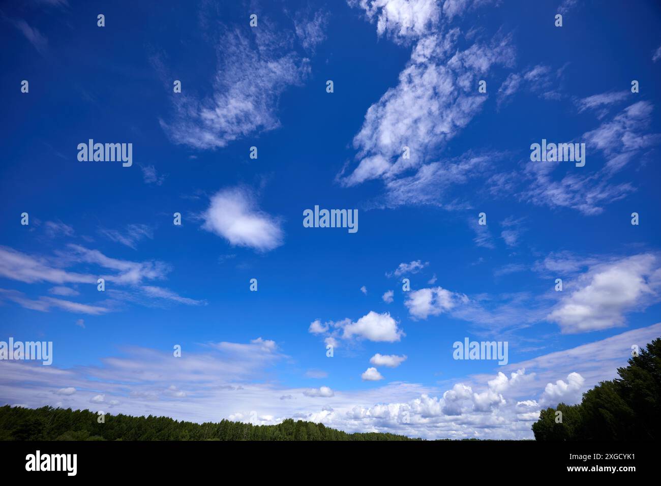 Blue sky background with white clouds at sunny day Stock Photo - Alamy