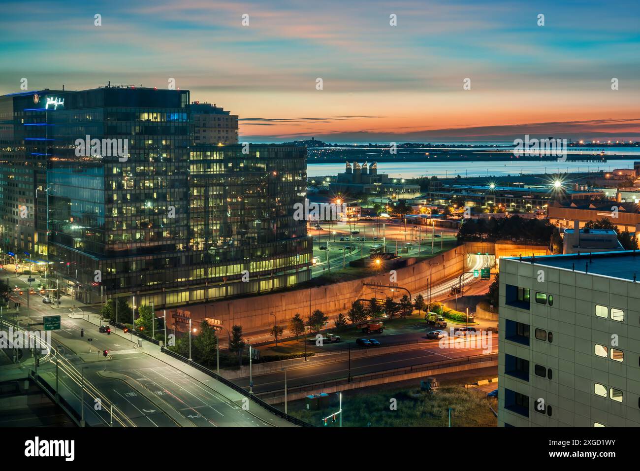 First light over South Boston Waterfront looking towards Logan International Airport. Stock Photo