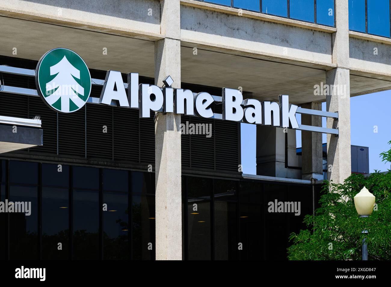 Grand Junction, CO, USA - June 13, 2024; Colorado based Alpine Bank sign on building with logo Stock Photo