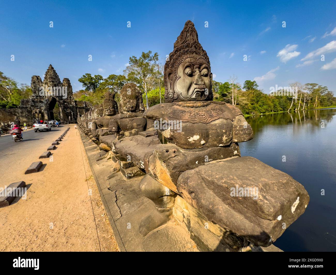 The bridge to Angkor Thom, lined on both sides with figurines ending in ...