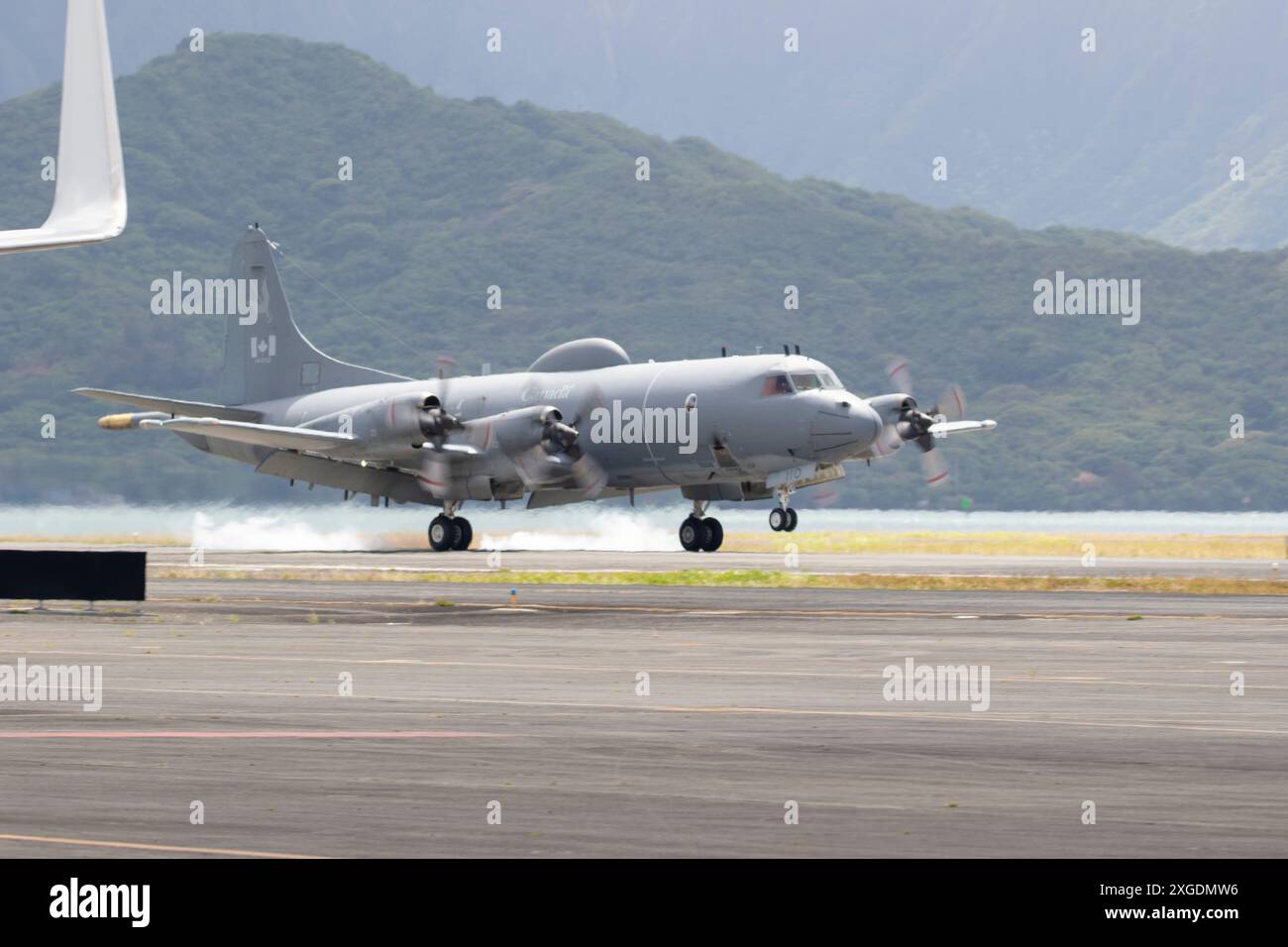 A Royal Canadian Air Force P-3 Orion and its crew arrive at Joint Base Pearl Harbor-Hickam, Hawaii, to participate in Exercise Rim of the Pacific (RIM Stock Photo