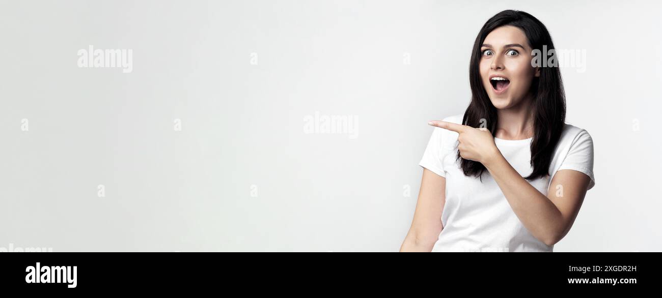 Portrait pointing happy woman hi-res stock photography and images - Alamy