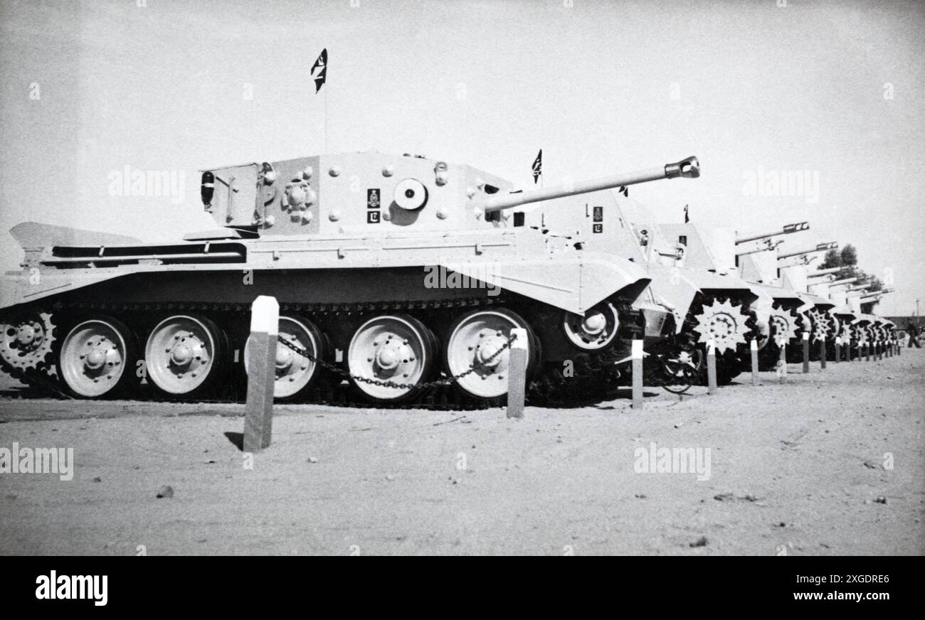 A battery of the 1st Regiment Royal Horse Artillery in Egypt, c. 1950. In the foreground is a Cromwell command tank with Sexton self-propelled artillery behind. Stock Photo