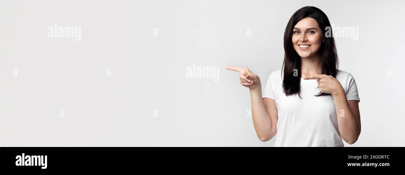 Pointing white shirt woman hi-res stock photography and images - Alamy