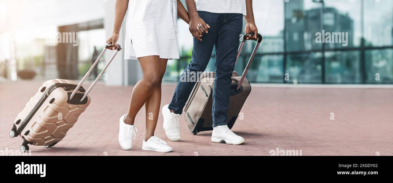 Couple Walking With Luggage Through Airport Terminal During Daytime ...