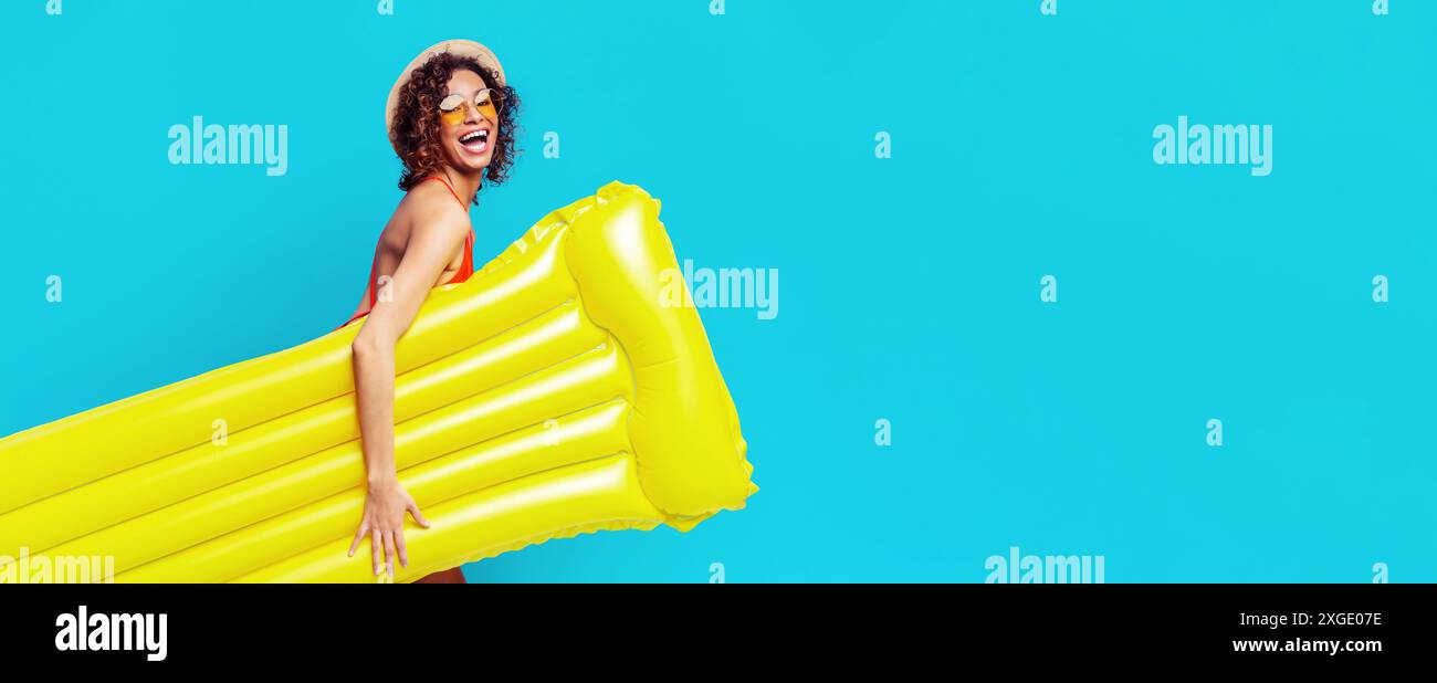 Woman In Inflatable Raft Woman in Red Swimsuit, Straw Hat Holding Yellow Inflatable Raft Stock ...