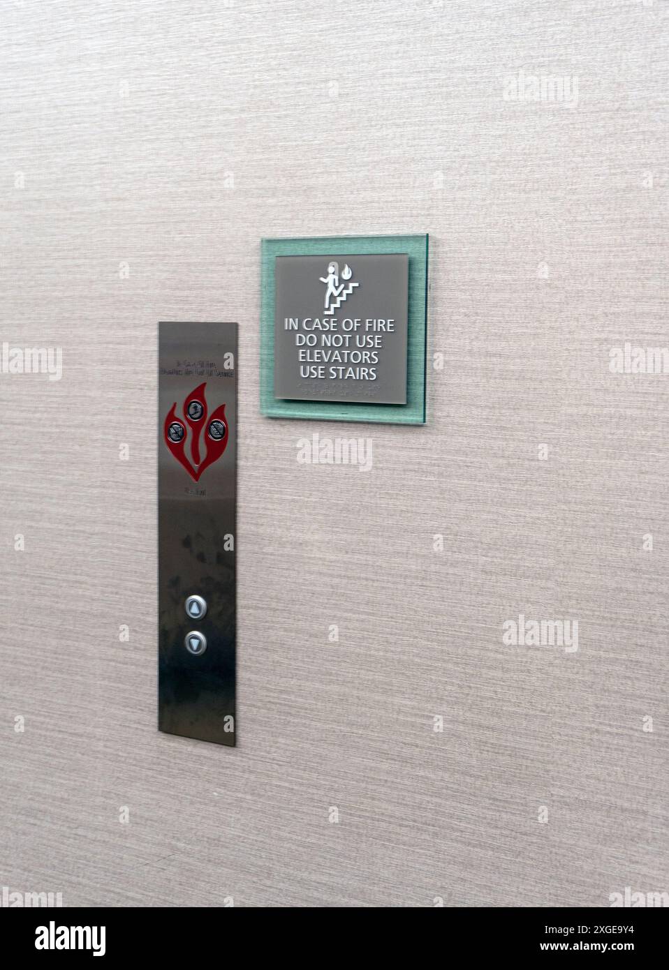 In case of fire warning outside a hotel elevator Stock Photo