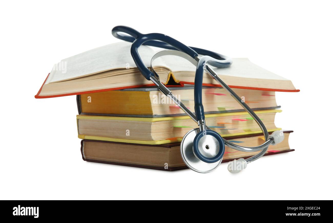 Stethoscope on stack of books against white background Stock Photo - Alamy