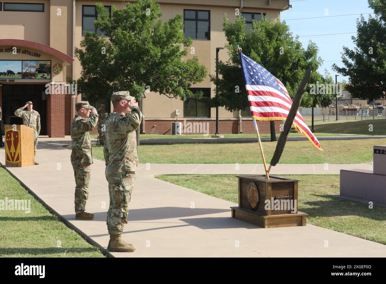 The incoming and outgoing commanders of Bravo Battery, 3rd Battalion, 2nd Air Defense Artillery Regiment, render honors during the battery's change of command ceremony. Bravo Battery, a Patriot battery, is instrumental in ensuring the U.S. Army maintains critical air defense assets ready to deploy at a moments notice. Stock Photo