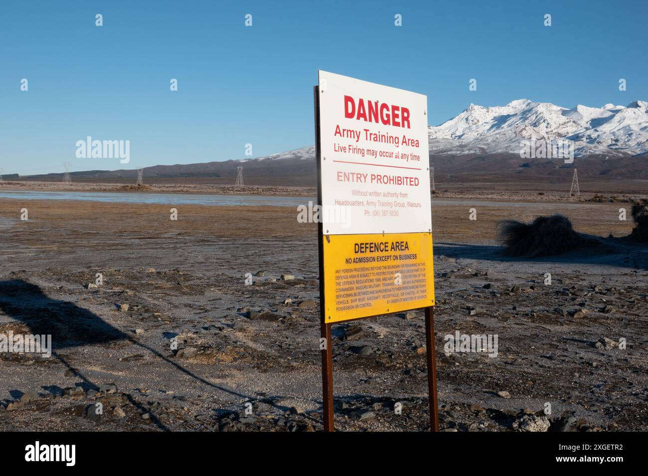 Army sign warning of restricted area in front of Mount Ruapehu, New Zealand Stock Photo