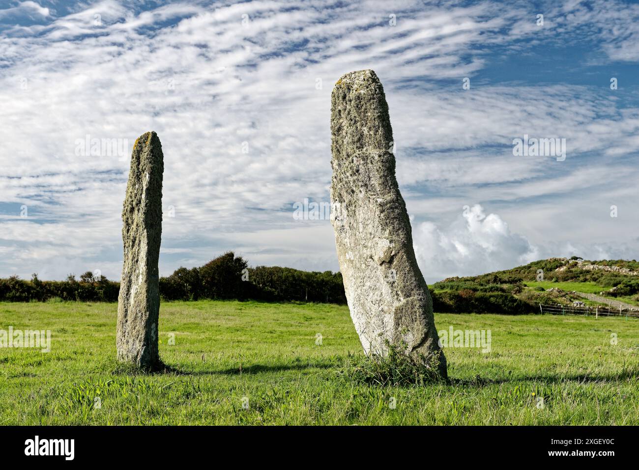 Penrhos Feilw prehistoric standing stone pair near Holyhead, Anglesey, Wales. 3m high. Neolithic or Bronze Age. View from N.E. Stock Photo