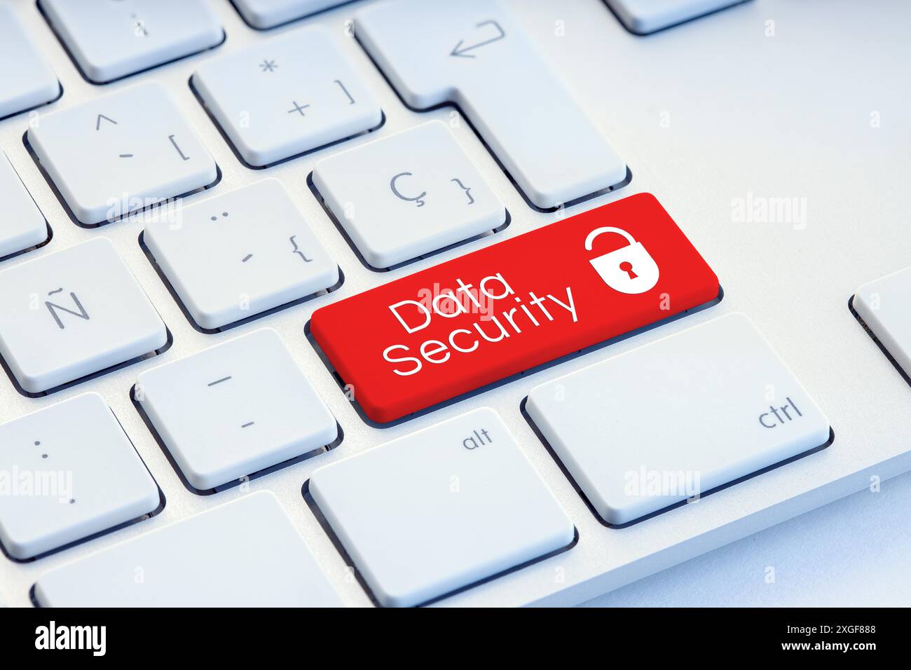 Cyber Security word and padlock icon on red computer keyboard Stock Photo