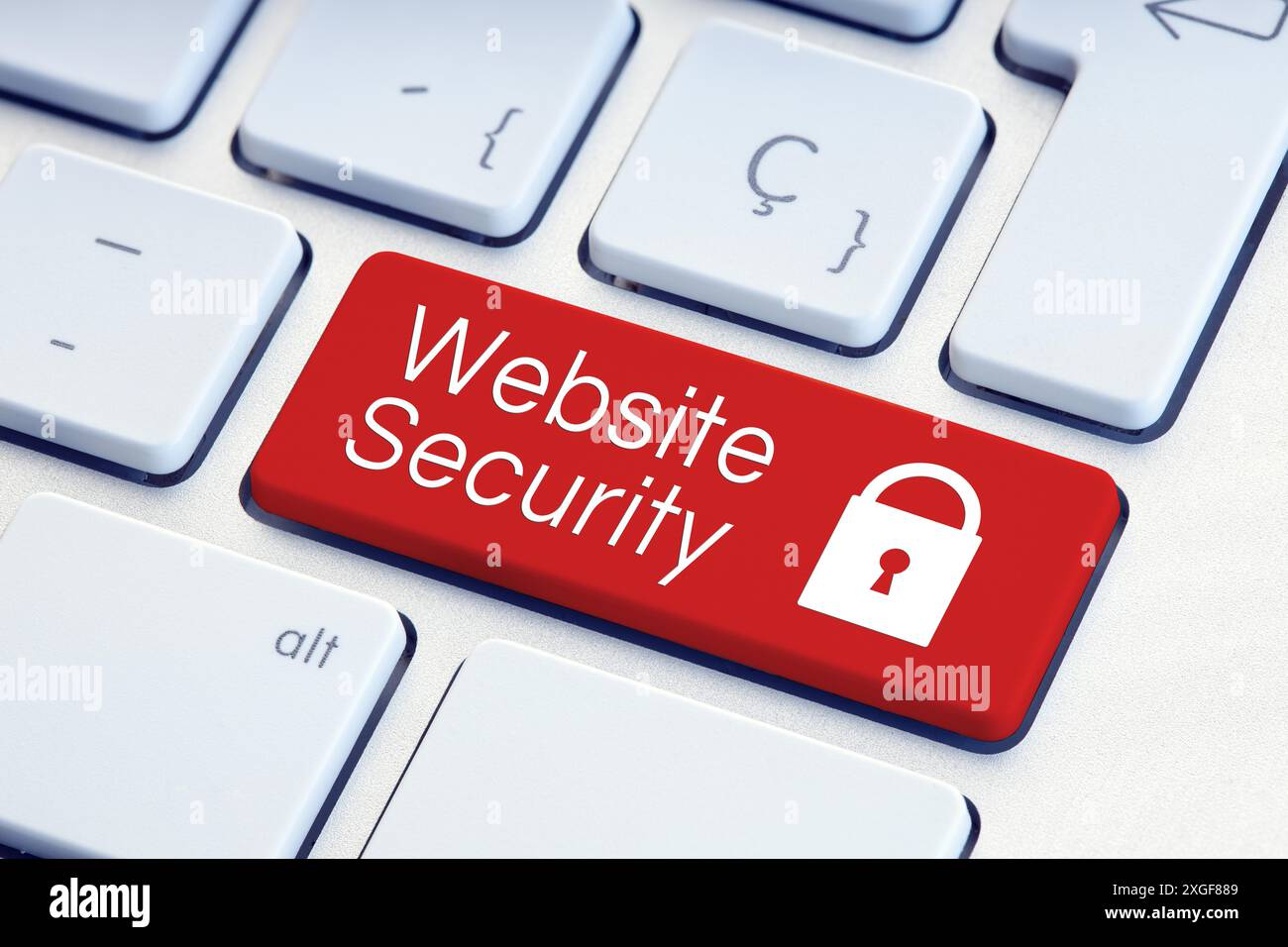 Website Security word and padlock icon on red computer keyboard Stock Photo