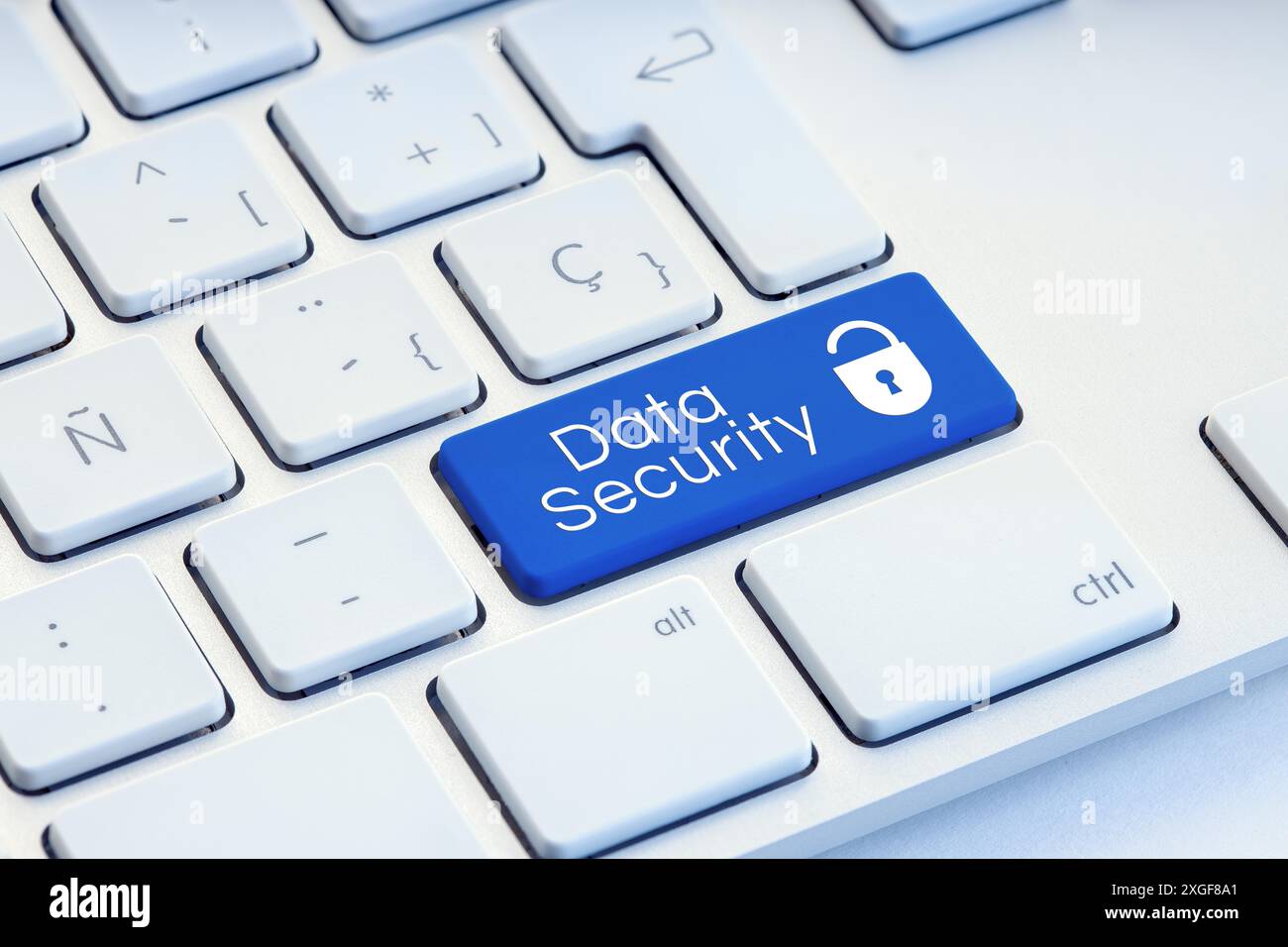 Cyber Security word and padlock icon on blue computer keyboard Stock Photo