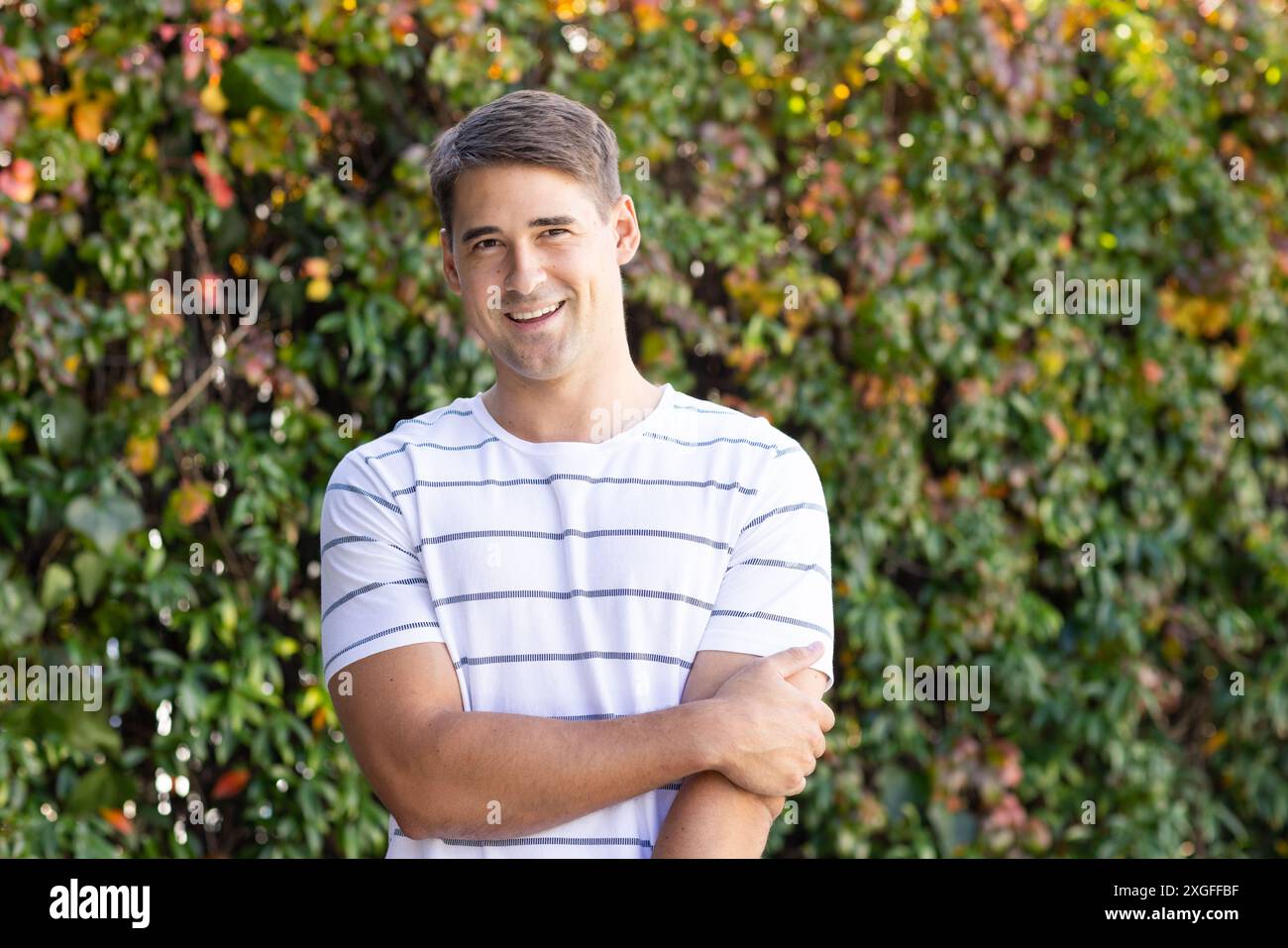 Man smiling standing outdoors hi-res stock photography and images - Alamy
