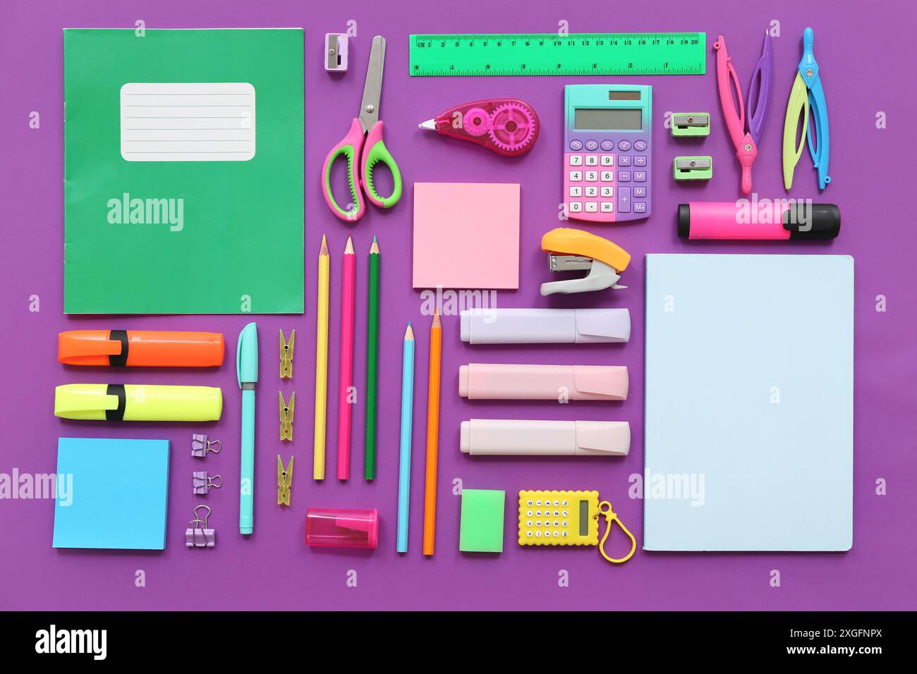 Different stationery on purple background Stock Photo