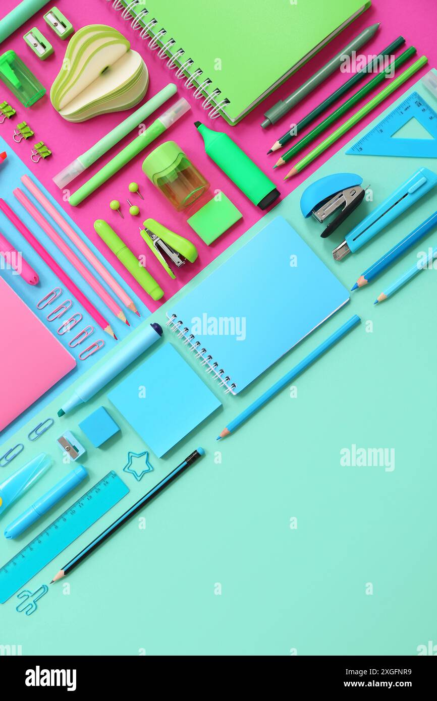 Composition with notebooks and stationery on color background Stock Photo