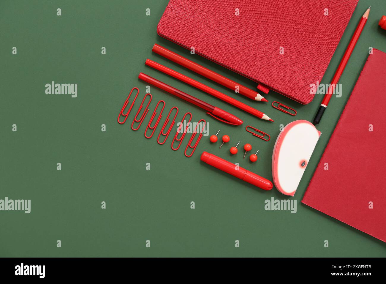Composition with different stationery on green background Stock Photo