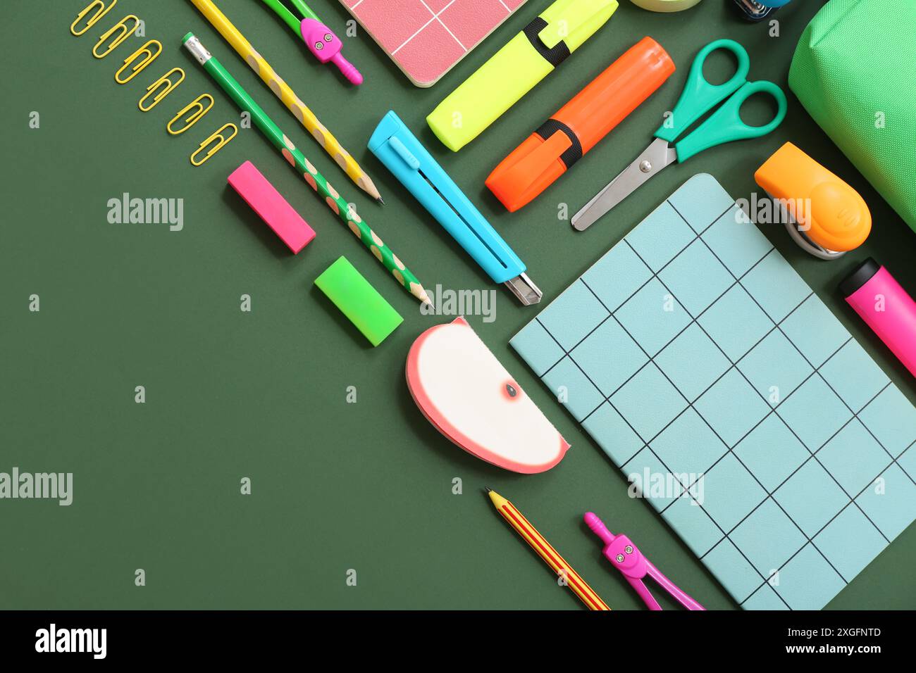 Composition with different stationery on green background Stock Photo