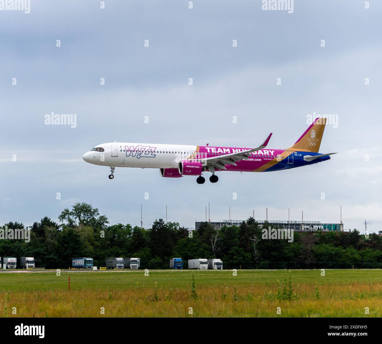 Wizz Air's Team Hungary livery painted Airbus A321 Neo is landing at Budapest Airport Stock Photo