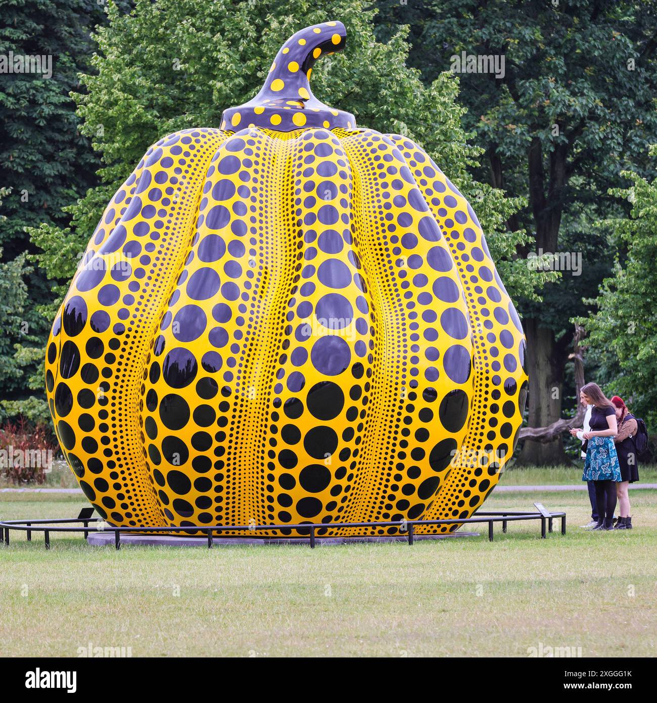London, UK. 09th July, 2024. This large-scale sculpture, 'Pumpkin' (2024), by Japanese Yayoi Kusama will be in situ by The Round Pond in Kensington Gardens until November and is free to visit in the grounds. It is Kusama's largest bronze pumpkin sculpture to date. Credit: Imageplotter/Alamy Live News Stock Photo