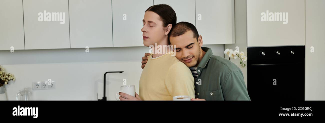 Two young men share a moment of intimacy in their modern apartment ...