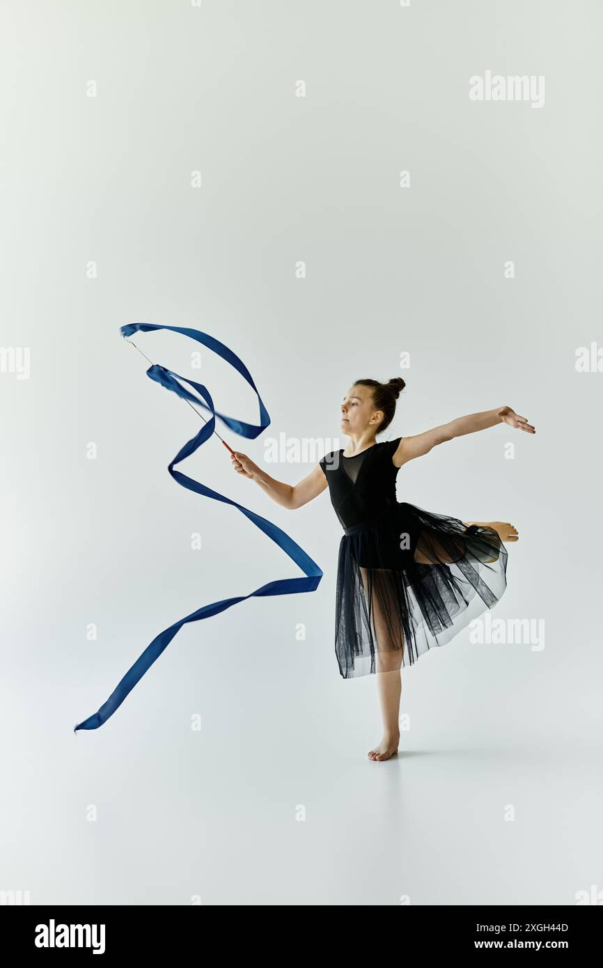 Prosethetic Ribbon A young girl with a prosthetic leg performs a graceful gymnastics ...