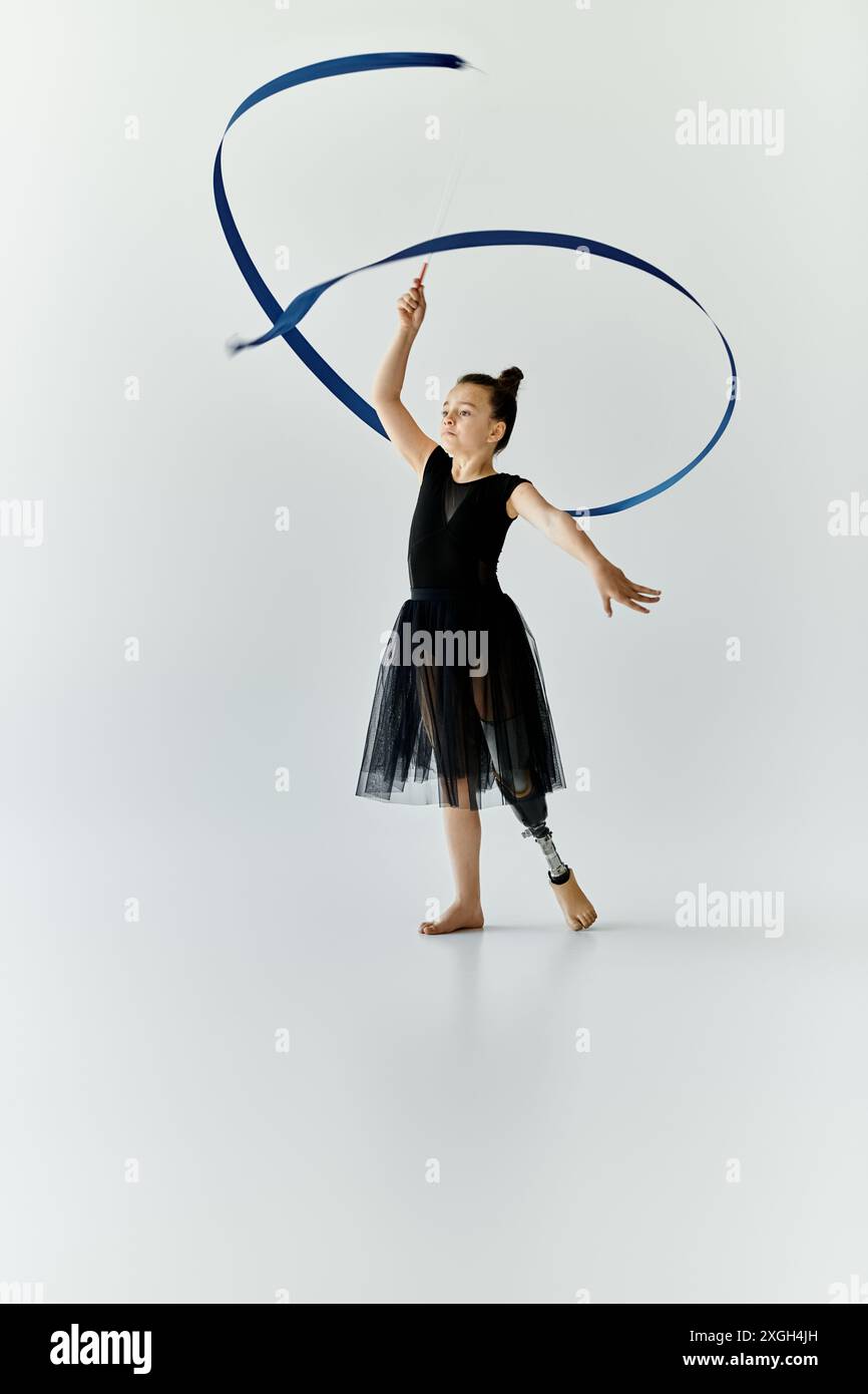 Prosethetic Ribbon A young girl with a prosthetic leg performs a graceful ribbon routine ...