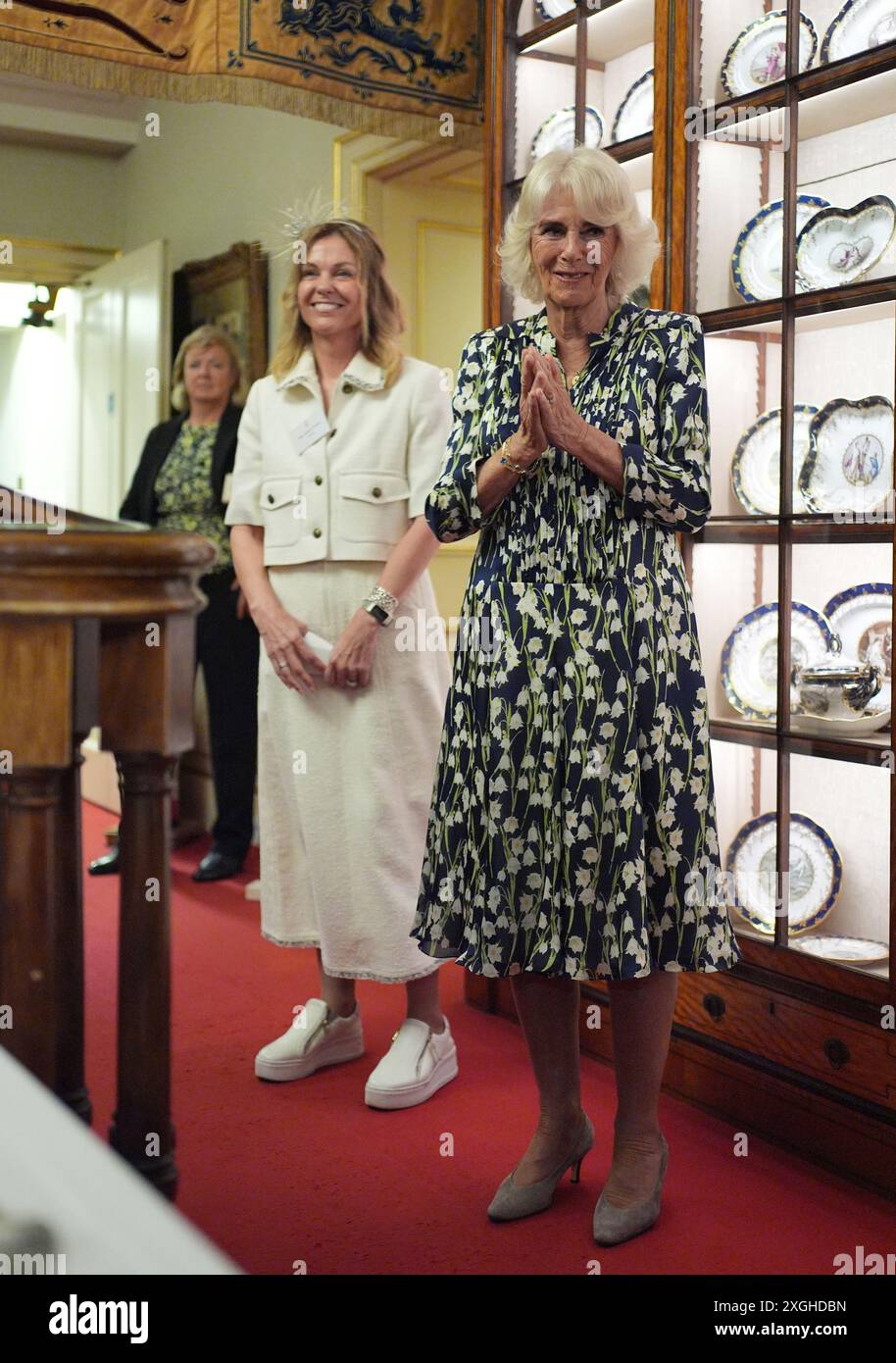 queen-camilla-accompanied-by-author-adele-parks-hosts-community