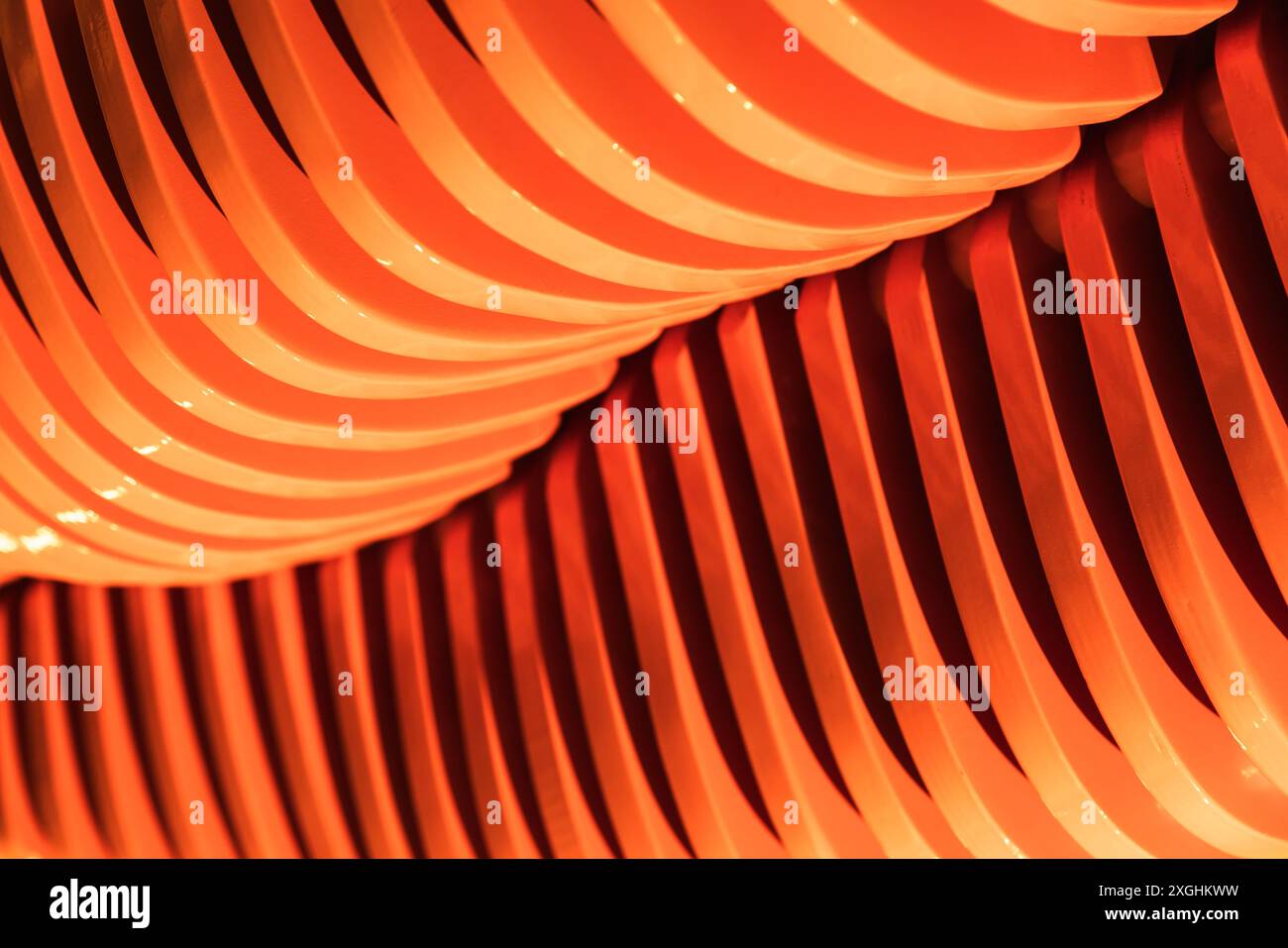 Abstract geometric pattern of parametric orange plywood structure, contemporary architecture photo background Stock Photo