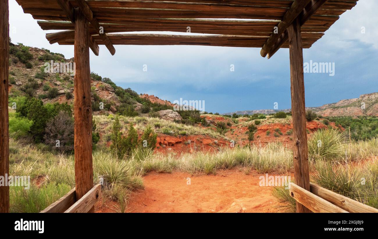 A partially covered awning made of natural local materials on a trail ...