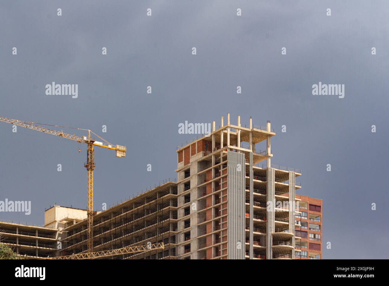 A high-rise building under construction and a Stock Photo - Alamy