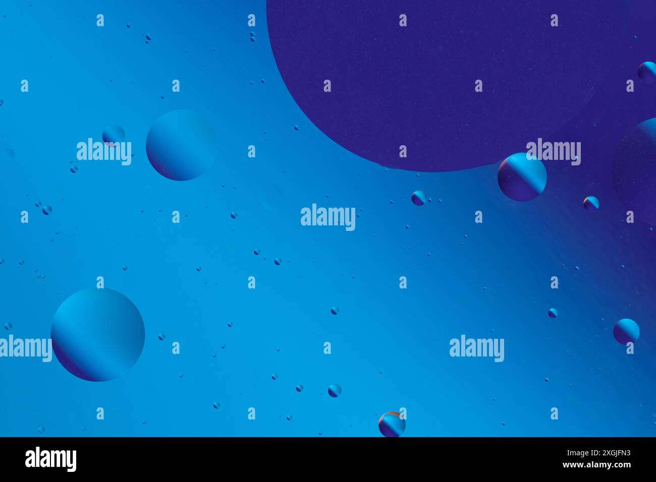 Blue abstract shapes and bubbles blend into a smooth, flowing pattern ...