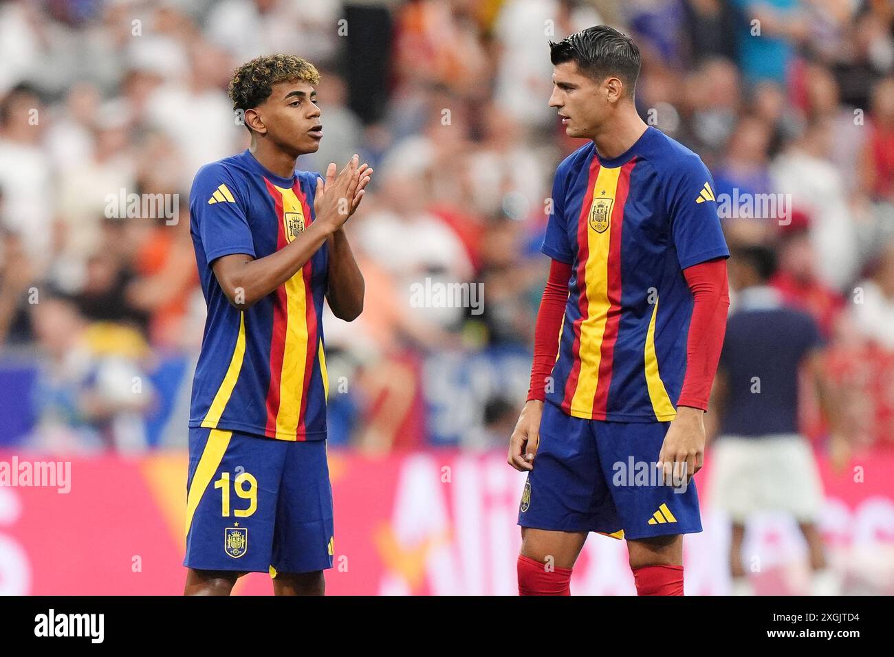 Spain's Lamine Yamal (left) and Alvaro Morata warm up ahead of the UEFA