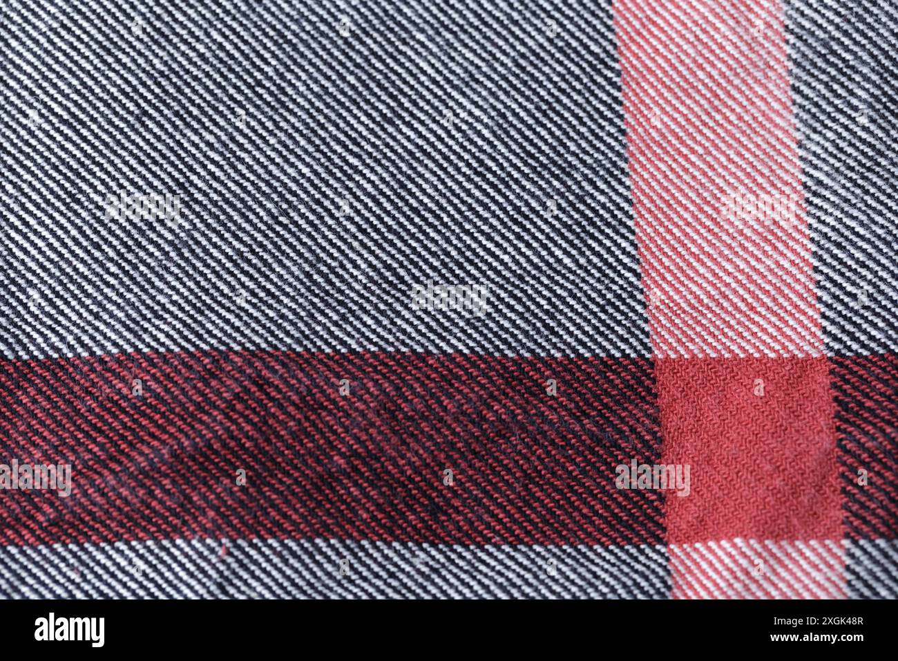 Gray and red kitchen cloth textile texture. Angle on one side. Stock Photo