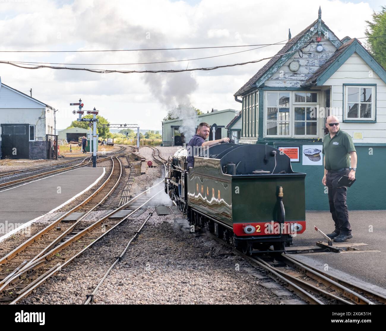 Train Reverse Steam train reversing past the signal house on the Romney, Hythe ...