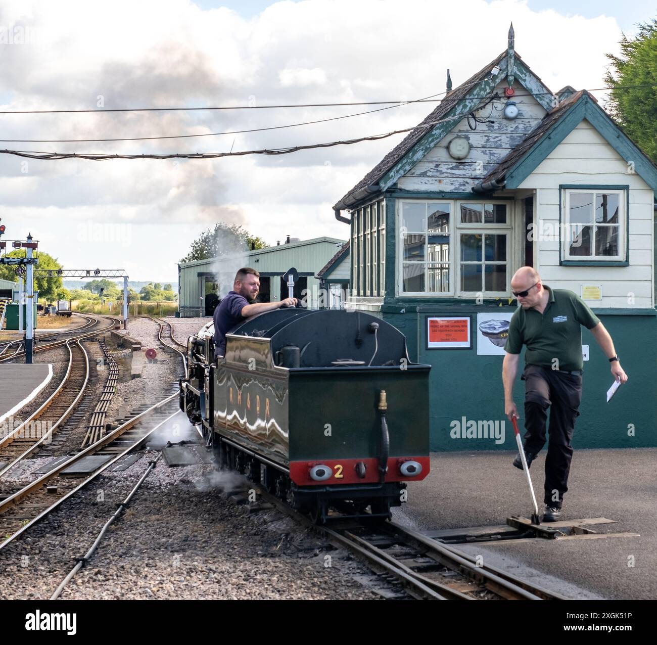 Steam train reversing past the signal house on the Romney, Hythe ...