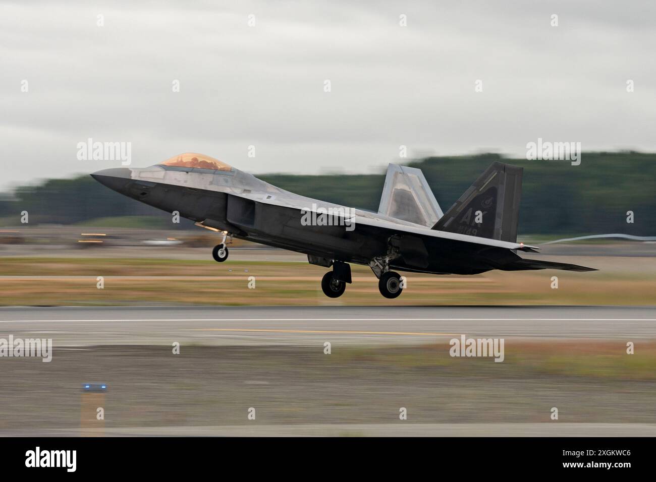 A U.S. Air Force F-22 Raptor assigned to the 3rd Wing takes off over ...