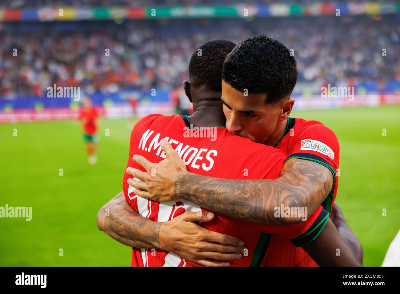Hamburg, Germany. 05th July, 2024. (L-R) Nuno Mendes and Joao Cancelo (Portugal) seen during the UEFA Euro 2024 game between national teams of Portugal and France at Volksparkstadium. (Portugal vs France - 3:5 after penalties) Credit: SOPA Images Limited/Alamy Live News Stock Photo