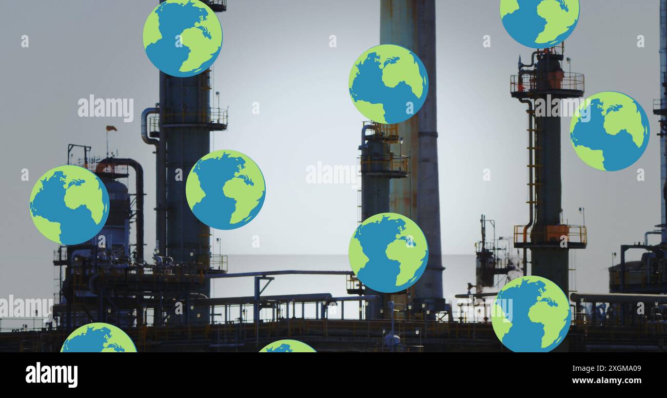 Image of falling globes over refinery. Global business, finances, data processing and digital interface concept digitally generated image. Stock Photo