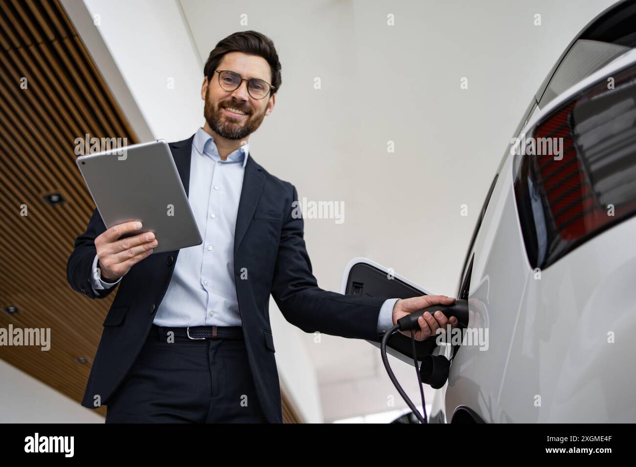 Dealer sells electric car in vehicle dealership location Stock Photo