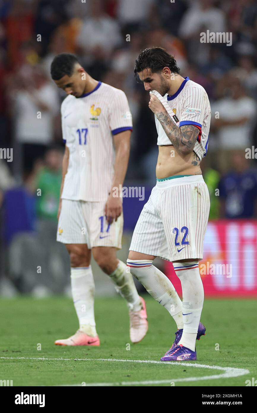 Munich , Germany 09.07.2024: French players Theo Hernandez of France, William Saliba of France   disappointed after defeat in the UEFA EURO 2024 semi- Stock Photo