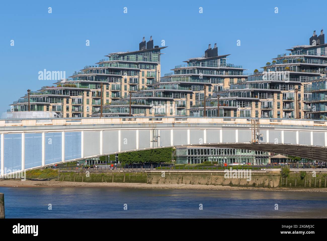 Wandsworth bridge with riverside development Battersea Reach in the background in London Stock Photo