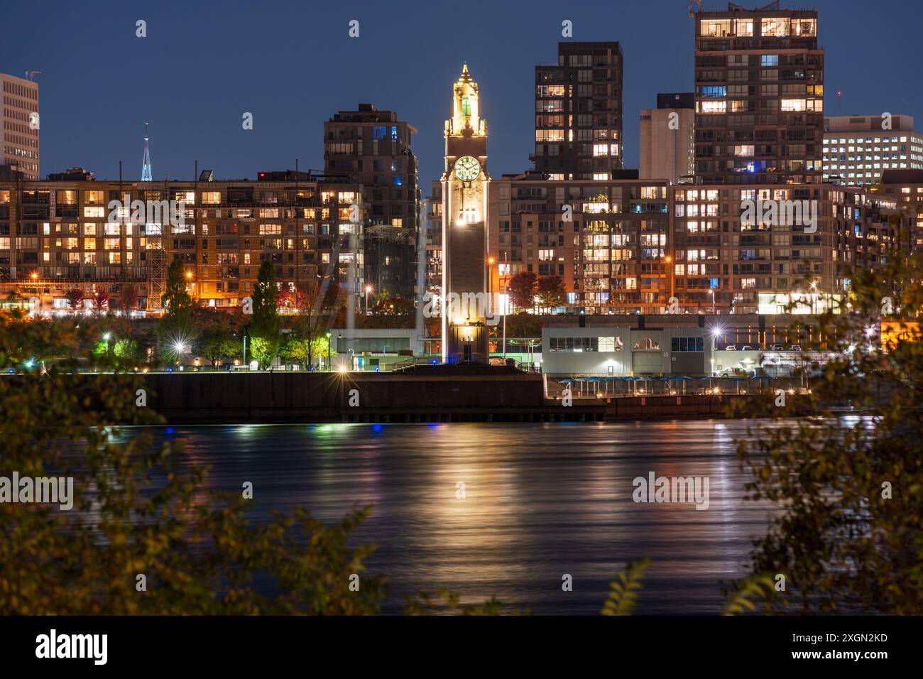 Old Port of Montreal Clock Tower illuminated at night. Montreal, Quebec, Canada. Stock Photo