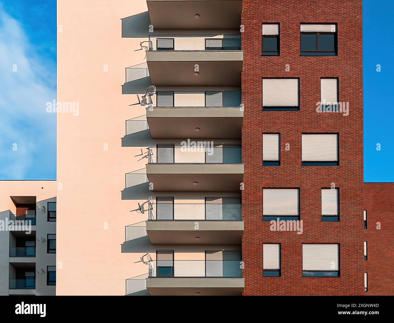 Modern new residential skyscraper building against blue sky, architectural patterns and background Stock Photo