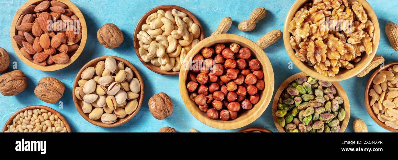 Nuts assortment panorama with many different nuts in wooden bowls Stock ...